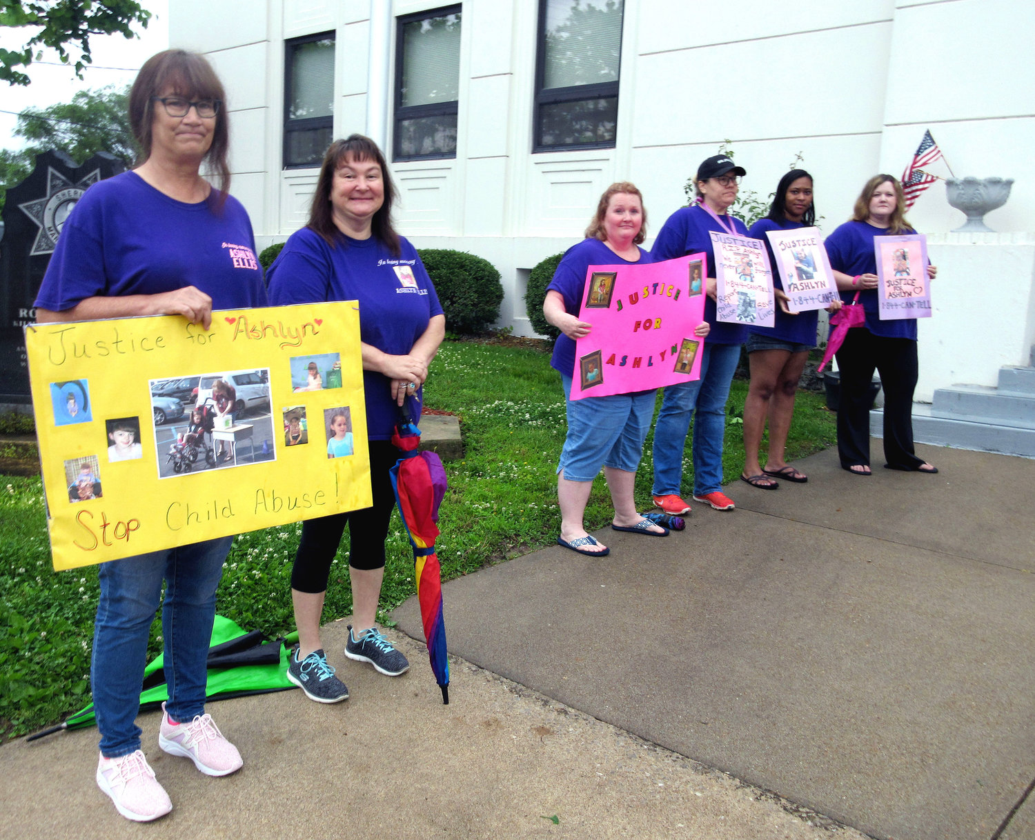A group of Ashlyn’s teachers (above) from B.W. Robinson School in Rolla expressed their support for their former student outside of the courthouse. Their signs said Justice for Ashlyn and Stop Child Abuse.